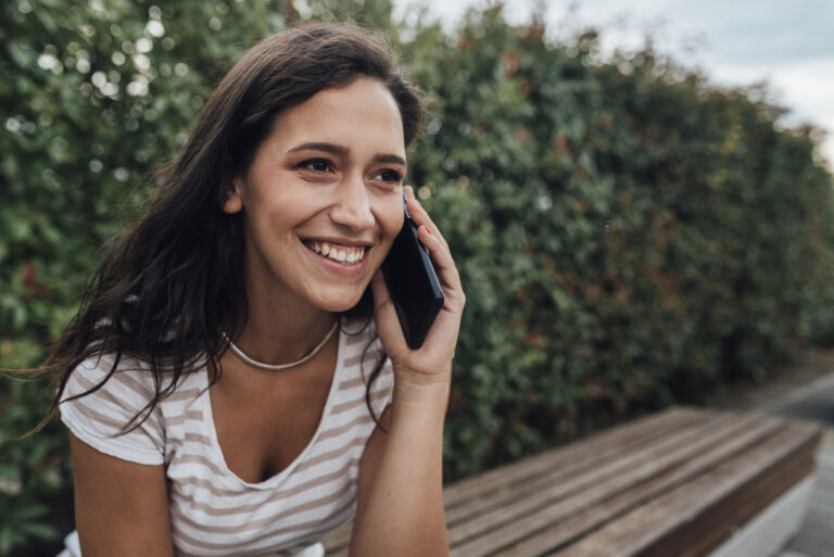 young woman using a whatsapp alternative free calling and texting app